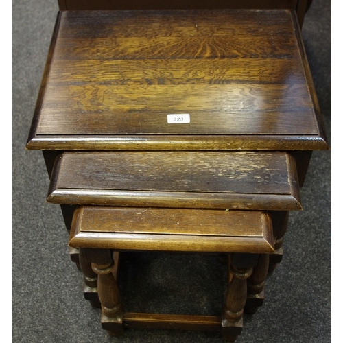 323 - A nest of oak tables, mid 20th century