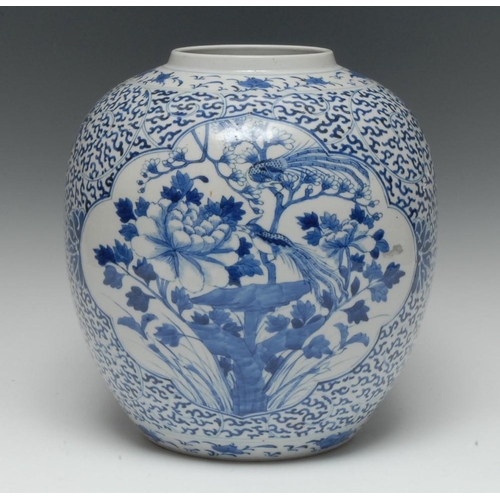 446 - A Chinese ovoid ginger jar, decorated in underglaze blue with fanciful birds and foliage, the ground... 