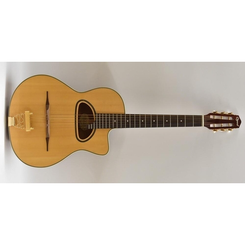 3002 - An Ozark 3513 six string acoustic 'Jazz' Guitar. Having a fine Spruce soundboard, ivorine binding, m... 