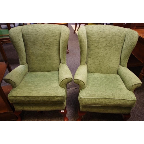 366 - A pair of contemporary wingback armchairs; a woven wicker tub chair (3)