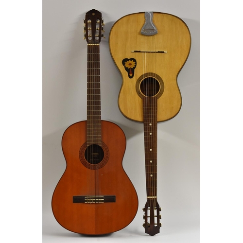 3023 - A Yamaha G65A six string classical acoustic guitar, having a fine cedar soundboard, mahogany sides a... 