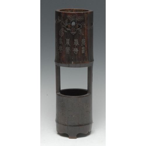 500 - A Chinese bamboo brush pot or incense holder, pierced and carved with monumental landscapes and vers... 