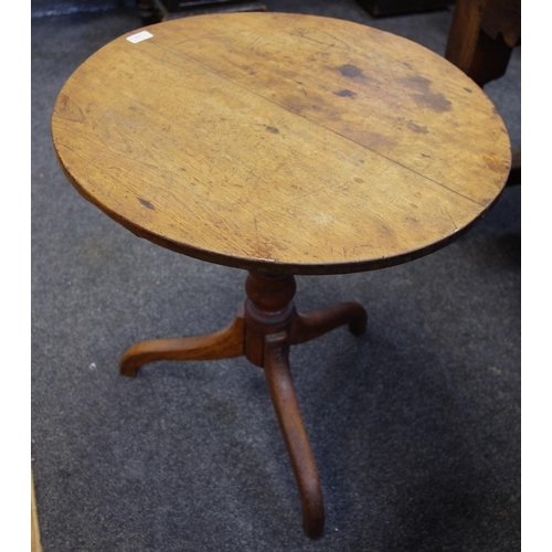 384 - A George III oak tripod table, circular top, turned column, circa 1830. 68cm high x 63cm diameter.