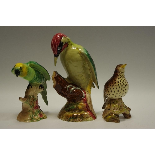 43 - A Beswick model of a woodpecker;thrush and parakeet (3)