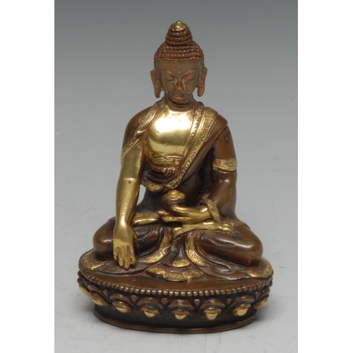 513 - Chinese/Tibetan School (19th/early 20th century), a parcel-gilt bronze, of Buddha  Bhaisajyaguru, se... 