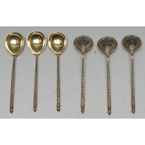 546 - A set of six Russian silver-gilt and niello spoons, each bowl decorated to verso with a city buildin... 