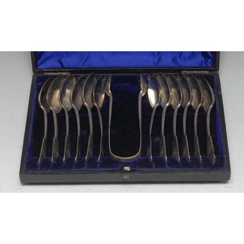 547 - A set of twelve Victorian Provincial silver Fiddle pattern teaspoons and sugar bows, Josiah Williams... 