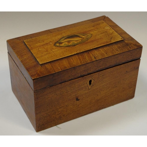 7 - A Victorian mahogany sarcophagus tea caddy, inlaid shell shaped patera to top