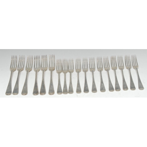 548 - A George V silver Feather-Edge Old English pattern part table service, comprising six table forks an... 