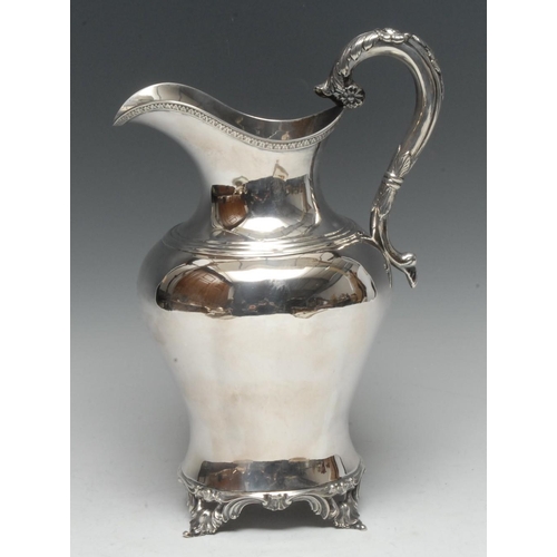 560 - A 19th century Colonial ovoid ewer, acanthus-grasped scroll handle terminating in flowerheads, acant... 