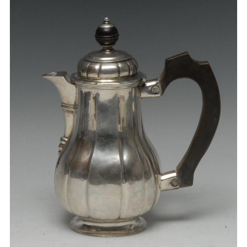 562 - A 19th century Continental silver fluted baluster covered jug, hinged domed cover with globular knop... 