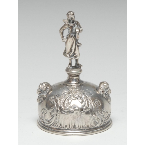 563 - A 19th century Continental silver table bell, the handle cast as a figure holding a tambourine, the ... 