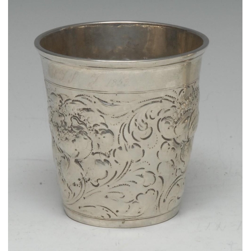 567 - A 19th century Scandinavian silver tapered cylindrical beaker, repousse chased with flowers and scro... 