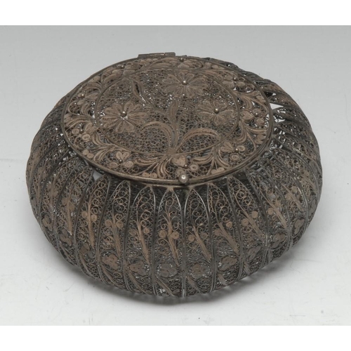 568 - A 19th century silver filigree bun shaped box, hinged cover delicately worked in scrolls with flower... 