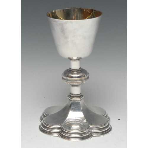 569 - A 20th century silver chalice, of typical form, gilded bowl, the column with knop, petal shaped spre... 