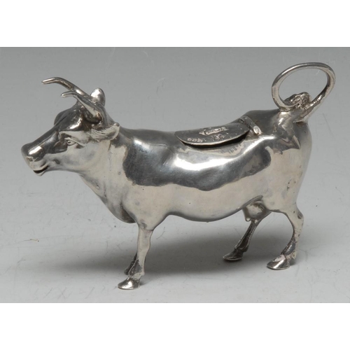 578 - A Continental cast silver cow creamer, in the manner of John Schuppe, hinged cover, 12cm long, impor... 