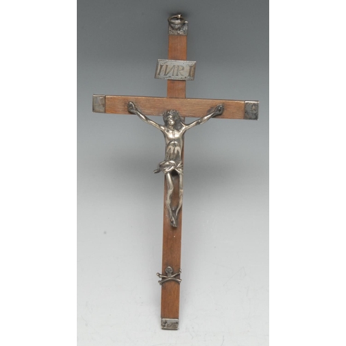 580 - A Continental silver Corpus Christi, hardwood cross, 19.5cm long, 19th century