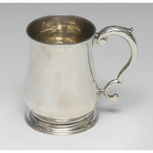 589 - A George II silver bell shaped half pint mug, quite plain, acanthus-capped double-scroll handle, ski... 