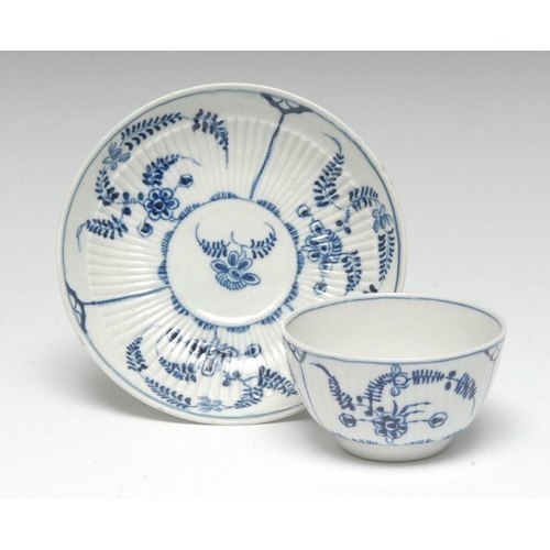 65 - A Worcester Immortelle pattern reeded tea bowl and saucer, painted in cobalt blue with formal ferns ... 