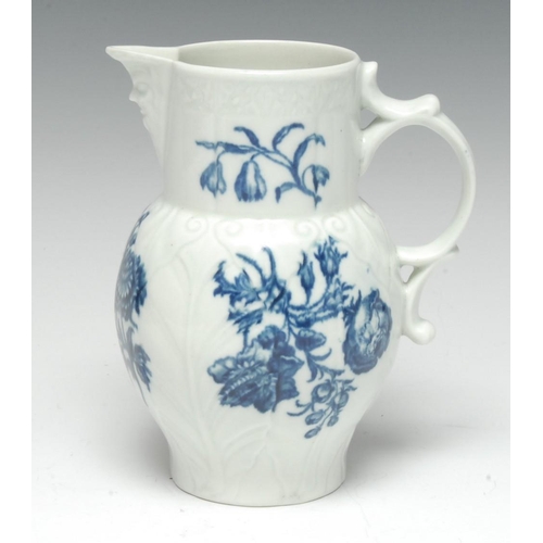 71 - A Worcester cabbage leaf moulded jug, mask spout, decorated with floral scrolls, 14cm high, crescent... 