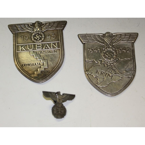 5191 - A pair German metal shields 1941-2 and 1943; a Nazi style lapel pin (3)