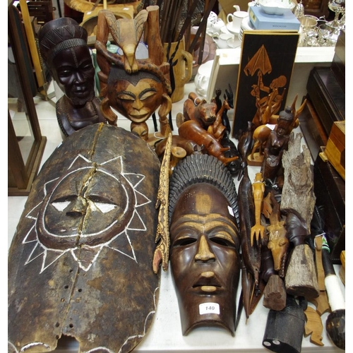 109 - Tribal art - a large African mask; another; a carved bust of an African elder; various carved Africa... 