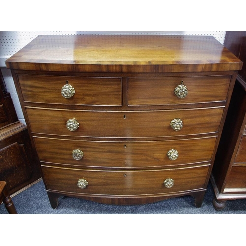 155 - A George III mahogany bowfront chest of two short cockbeaded drawers over three long, c. 1820. 108.5... 