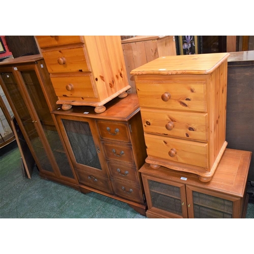 548 - A pair of pine bedside chests; a reproduction media cabinet; a glazed door bookcase; a similar telev... 