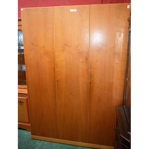 551 - A mid-20th century design triple wardrobe, 200.5cm high