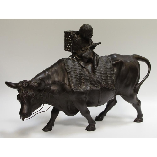 19 - A Chinese bronze boy riding a bull, 44cm long