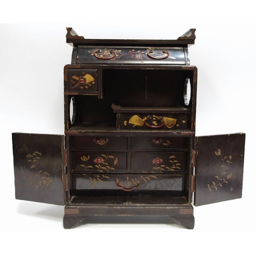 27 - An Aesthetic Movement chinoiserie table casket of temple form, typically painted with blossoming pru... 