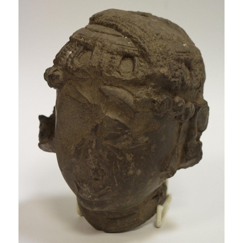 28 - An 18th century basalt head, Indonesian origin.