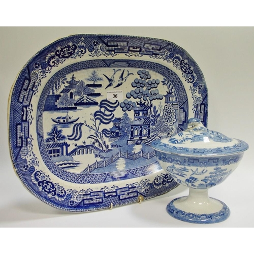 36 - A 19th century navette shaped blue and white sauce tureen, c1860; a late 19th century willow pattern... 