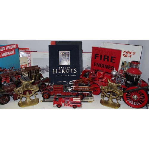 73 - Fire Service Interest - four model fire engines; a pair of brass flat backs surmounted with helmet; ... 