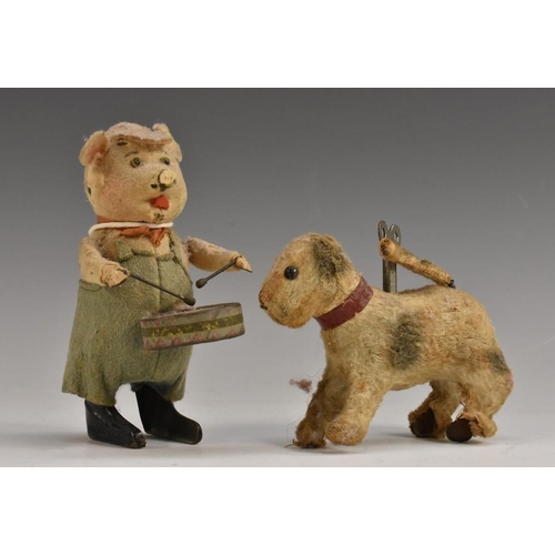 3072 - Mechanical Toys - a Schuco mechanical drumming pig, felt and tin plate body, standing with drum and ... 