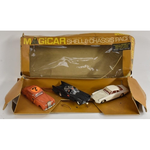 3103 - A Spot-on Tria-ang models Magicar shell and chassis pack, No 982, with  two chassis and car tops for... 