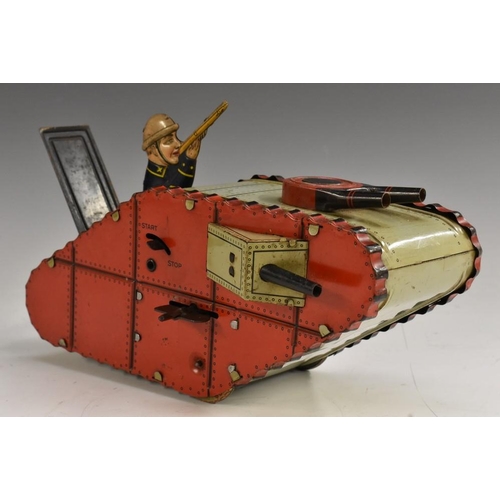 3114 - An early 20th century Marx Toys German clockwork tin plate lozenge form battle tank, with red and pa... 