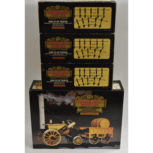 3157 - A Hornby Railways Stephenson's Rocket Real Steam Train Set, G100, boxed; G102 three boxes of additio... 