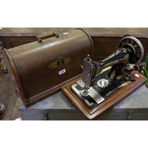 490 - A hand powered Singer sewing machine 1211138, domed top case.