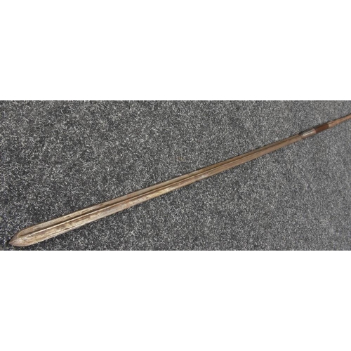 3041 - A Maasai lion spear, 88cm fullered blade, hardwood grip, spike pommel, 166cm long overall, c.1900