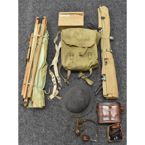 3287 - World War Two - a Brodie helmet; a field stretcher; field glasses; headphones; etc