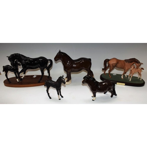 124 - A Beswick ceramic model of a horse and foal, First Born, boxed; another, Royal Doulton, Black Beauty... 