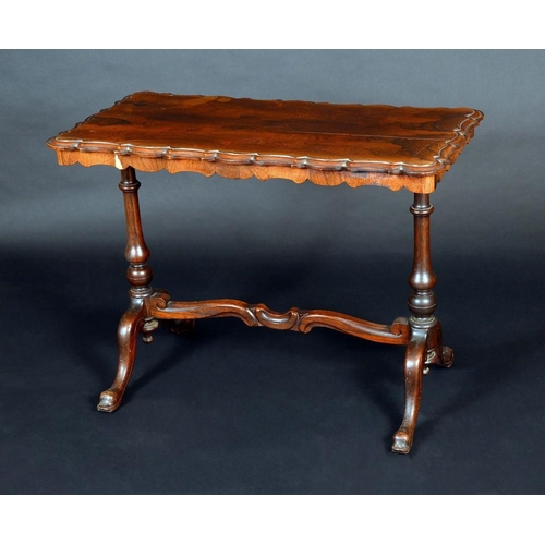 233 - An early Victorian rosewood shaped rectangular centre table, oversailing top, baluster end supports,... 