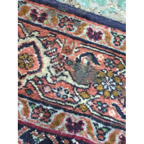 486 - A Middle Eastern style carpet, 177cm x 112cm