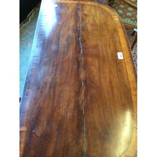 487 - A 19th century mahogany card table, crossbanded hinged top enclosing a baize lined playing surface a... 