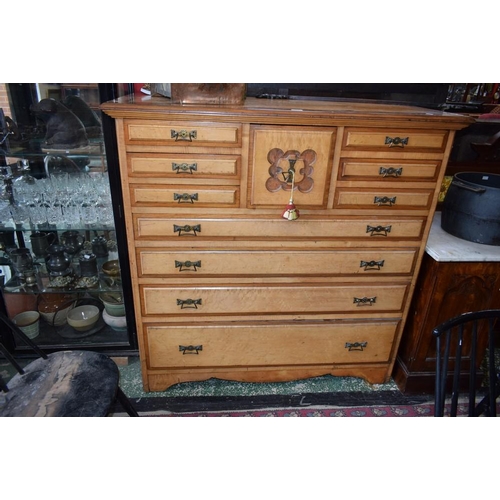 504 - An early 20th century satinwood and mahogany chest, oversailing rectangular top above an arrangement... 