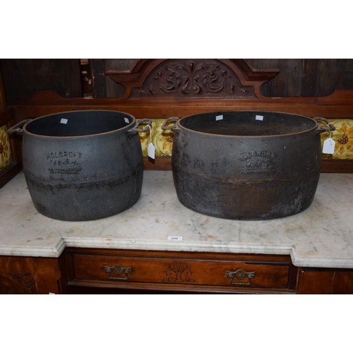 507 - An early 20th century Holcroft 48 pint cast iron cooking vessel; another 40 pint, both dated 1932 (2... 