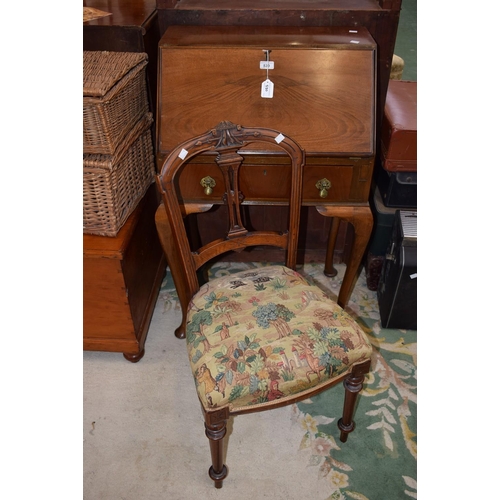 530 - A reproduction mahogany bureau, fall front enclosing a writing surface, small drawer and an arrangem... 