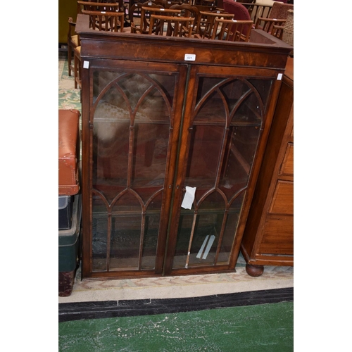 531 - A 19th century mahogany bookcase top, outswept cornice above a pair of glazed doors enclosing shelve... 