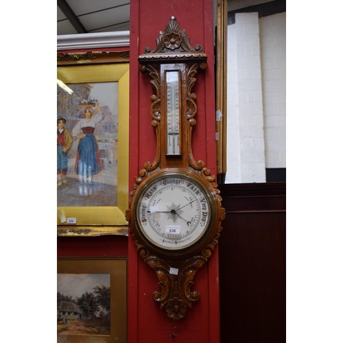 536 - An early 20th century carved oak barometer thermometer, c.1910